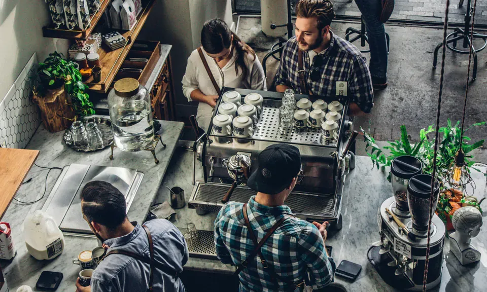 Local business team working together in a cafe